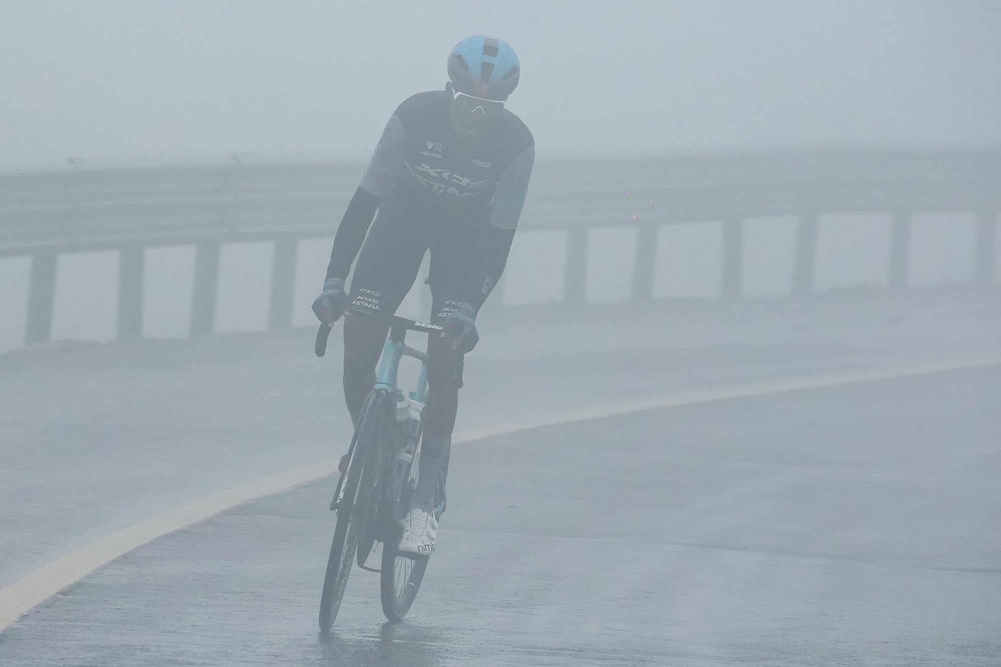 A rider heading through the challenging conditions of stage 5, which only continued through to a cancelled stage 6 of the 2026 Tour of Magnificent Qinghai