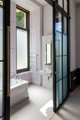 Purcell Wilderness House bathroom predominantly white in colour.