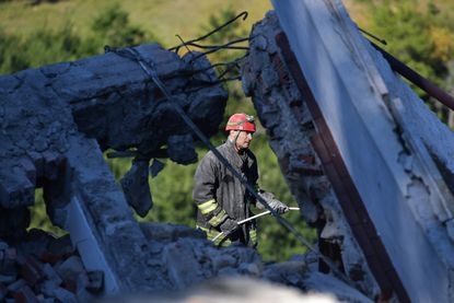 Emergency workers search for earthquake survivors in Italy