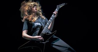 Debbie Gough of Heriot demoes the new Jackson Pro Plus Metal Phase II Warrior on a darkened studio set.