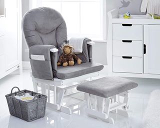 Obaby Deluxe Reclining Glider Chair and Stool in a grey and white nursery with a chest of drawers and changing table