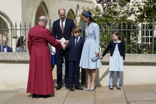 Prince William, Duke of Cambridge, Catherine, Duchess of Cambridge, Prince George and Princess Charlotte say goodbye to Dean of Windsor,