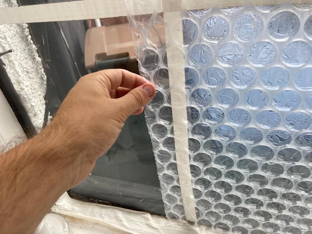 Placing the bubble wrap on the window glass