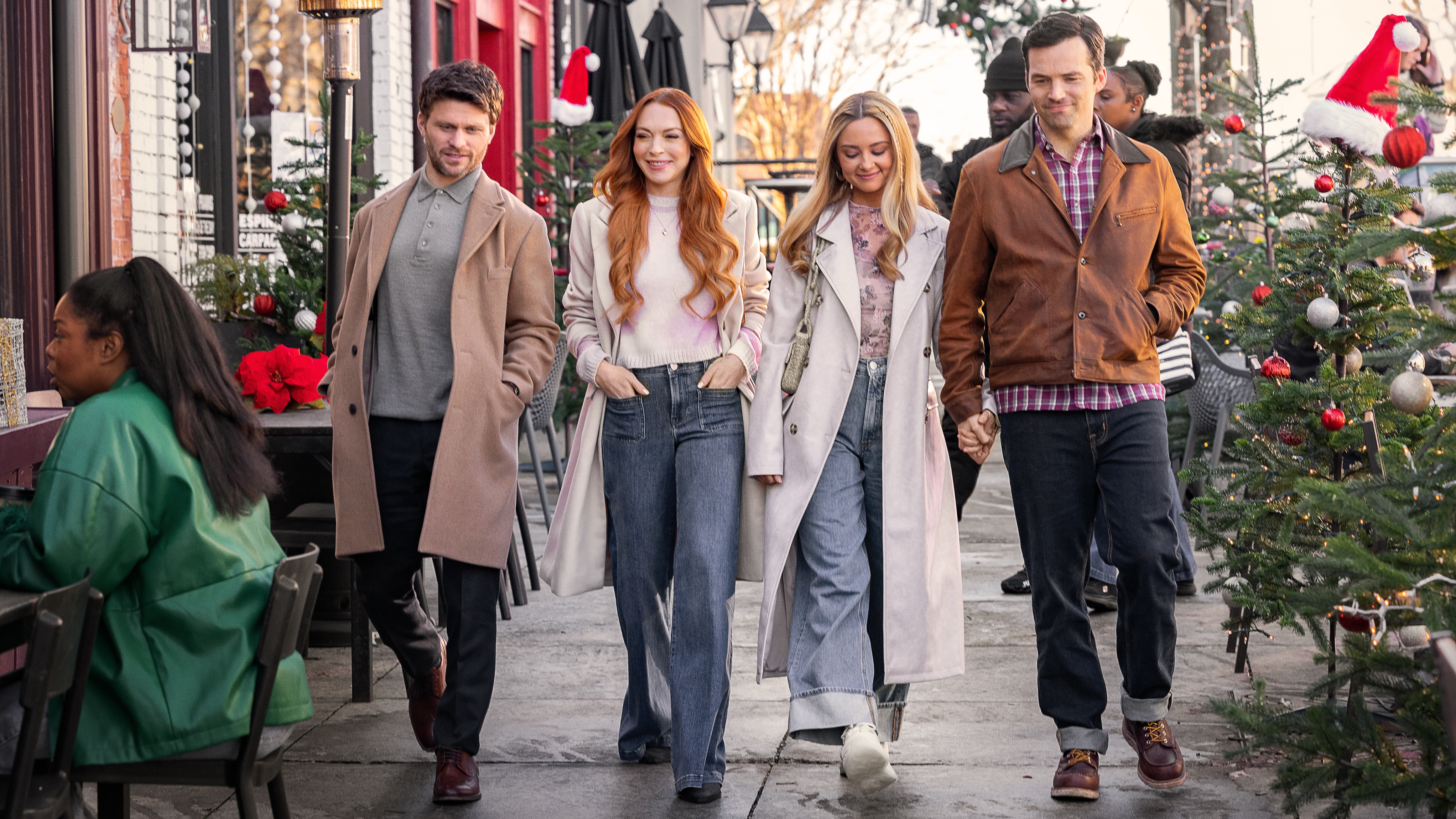 (L-R) Jon Rudnitsky as Cameron, Lindsay Lohan as Avery, Katie Baker as Cassie and Ian Harding as Logan walking in a line together in Our Little Secret.