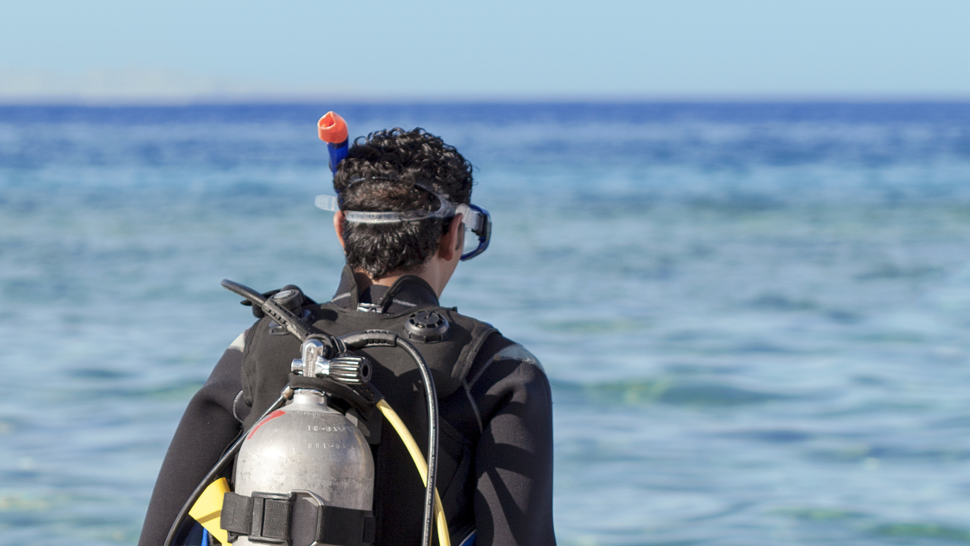 Scuba diver approaching the sea