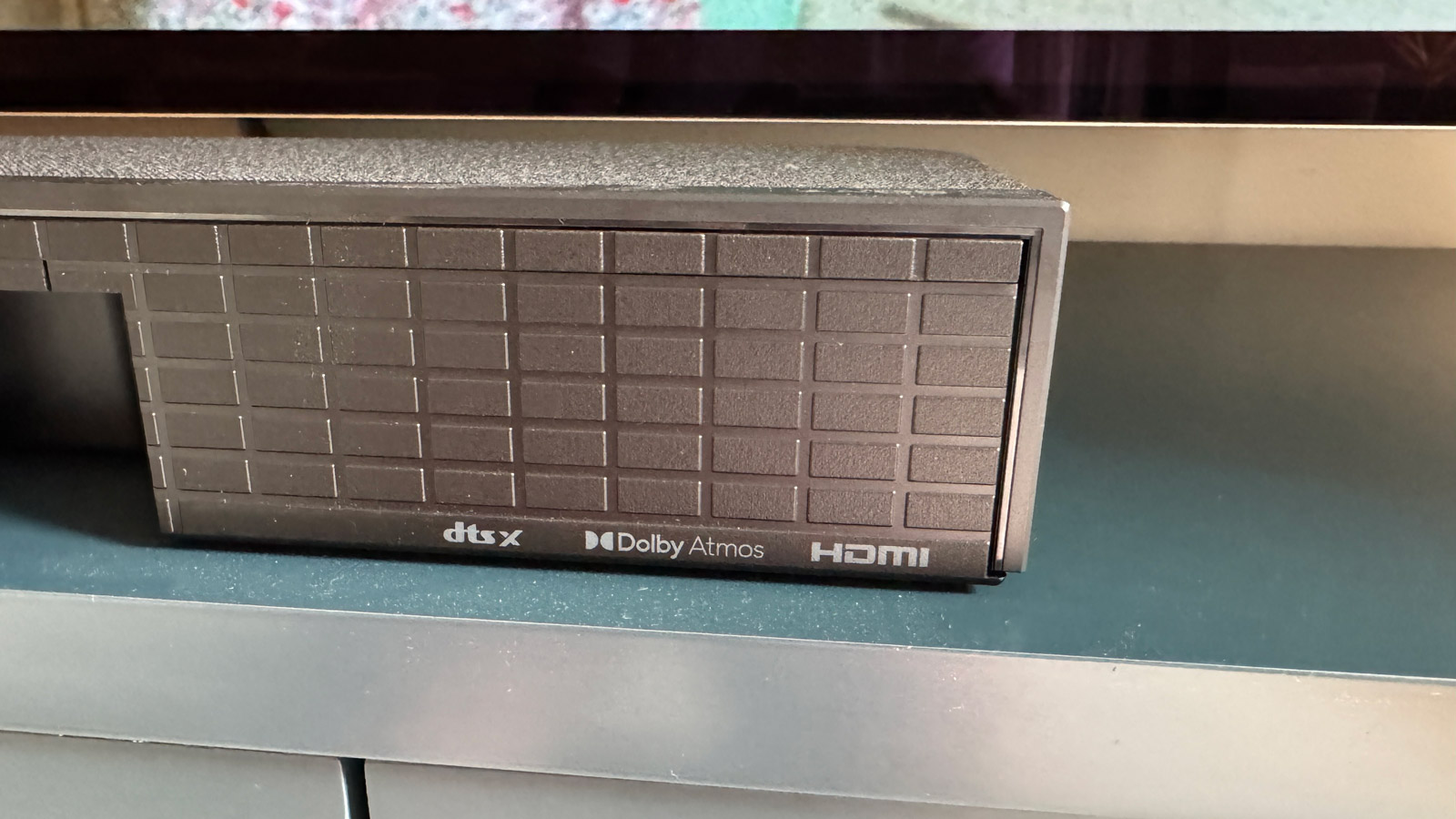 Rear view of the HDMI, DTS:X and Dolby Atmos logos on the Sony Bravia Theater Bar 8