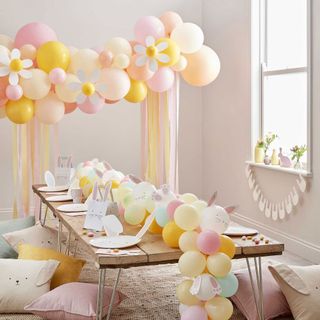 easter decorating ideas balloon arch over table ginger ray