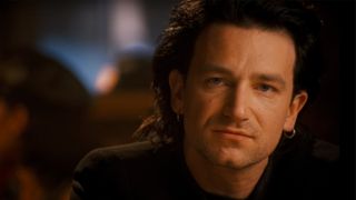 A close-up of Bono in U2's video for the song One