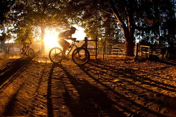 A team of two riders head out onto the course in the early morning light