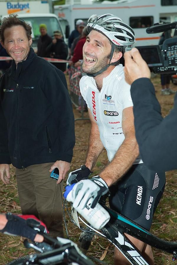 Sid Taberlay is ecstatic to hear from race director Nic Deka (left) that he has won the 2012 race by two seconds. Amazingly, puncture king Taberlay rode the last 3km of the race on a completely blown tyre.