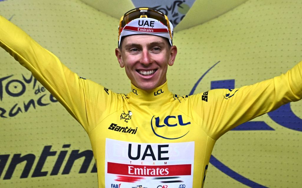 UAE Team Emirates teams Slovenian rider Tadej Pogacar wearing the overall leaders yellow jersey celebrates on the podium after the 6th stage of the 109th edition of the Tour de France cycling race 2199 km between Binche in Belgium and Longwy in northern France on July 7 2022 Photo by AnneChristine POUJOULAT AFP Photo by ANNECHRISTINE POUJOULATAFP via Getty Images