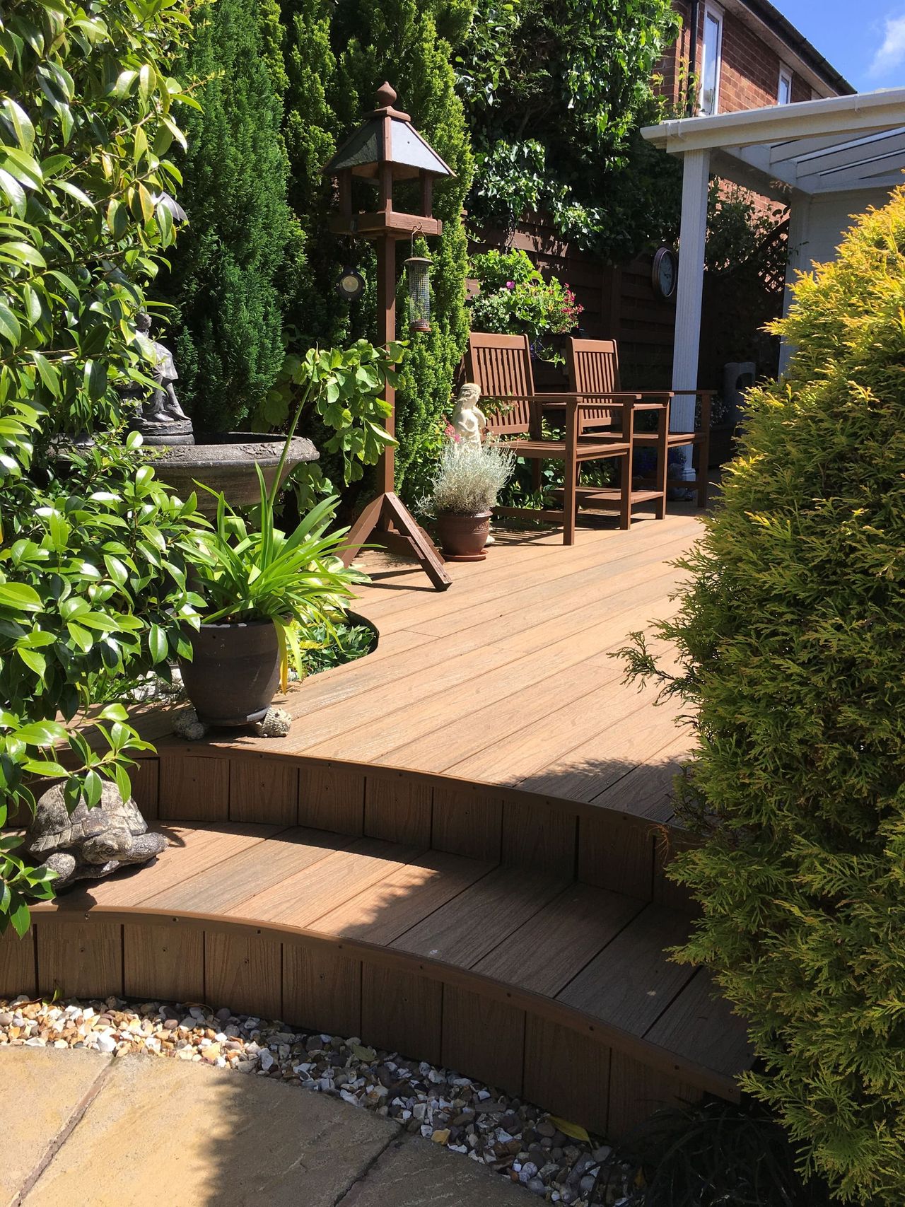 Curved decking steps in a garden