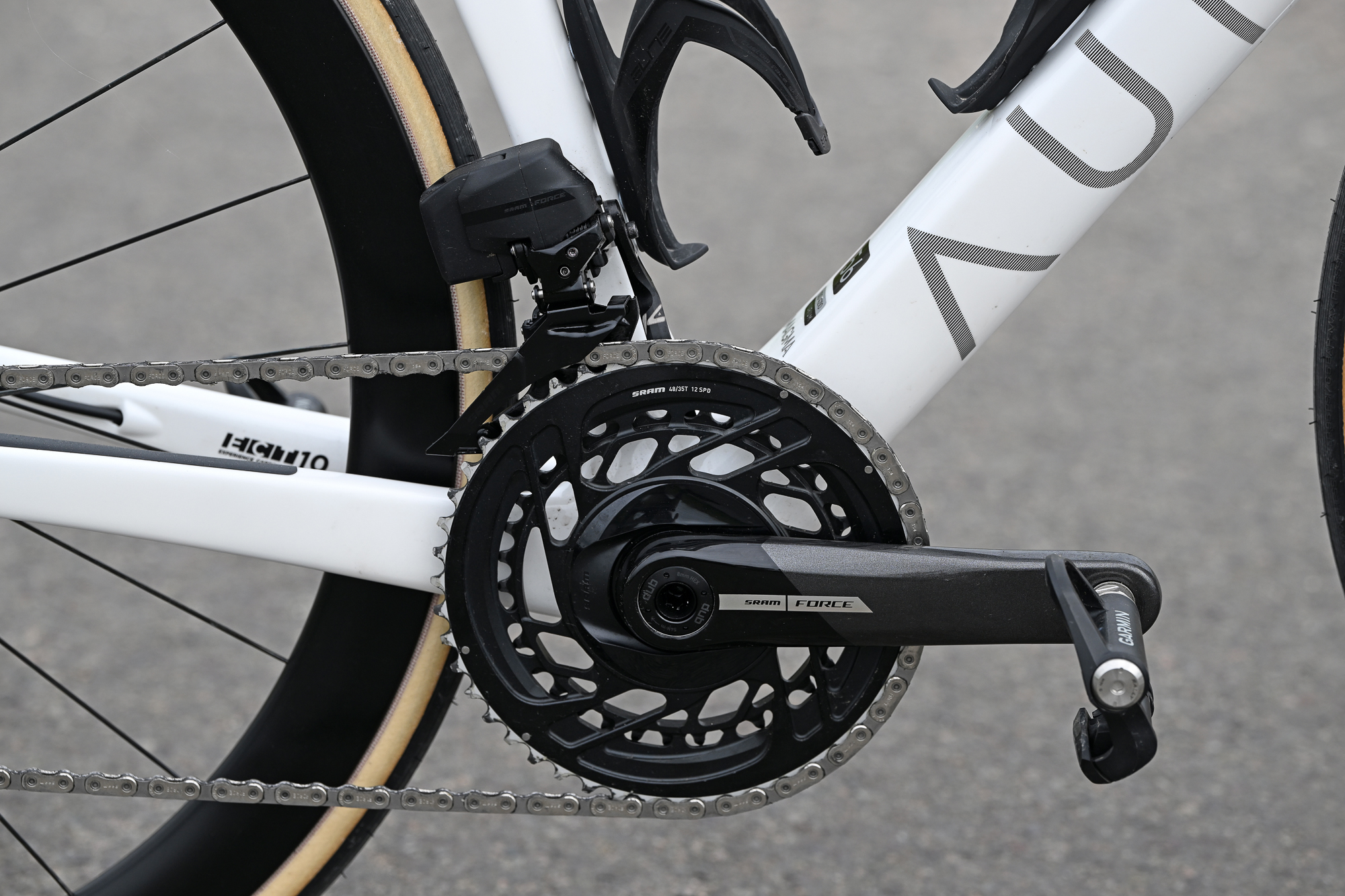 close up of a SRAM Force crankset on a white Aurum Magma