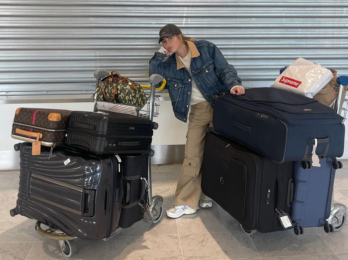 Girl with suitcases