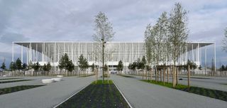 Exterior view of the stadium captured further away on the road leading to the building with trees and paths