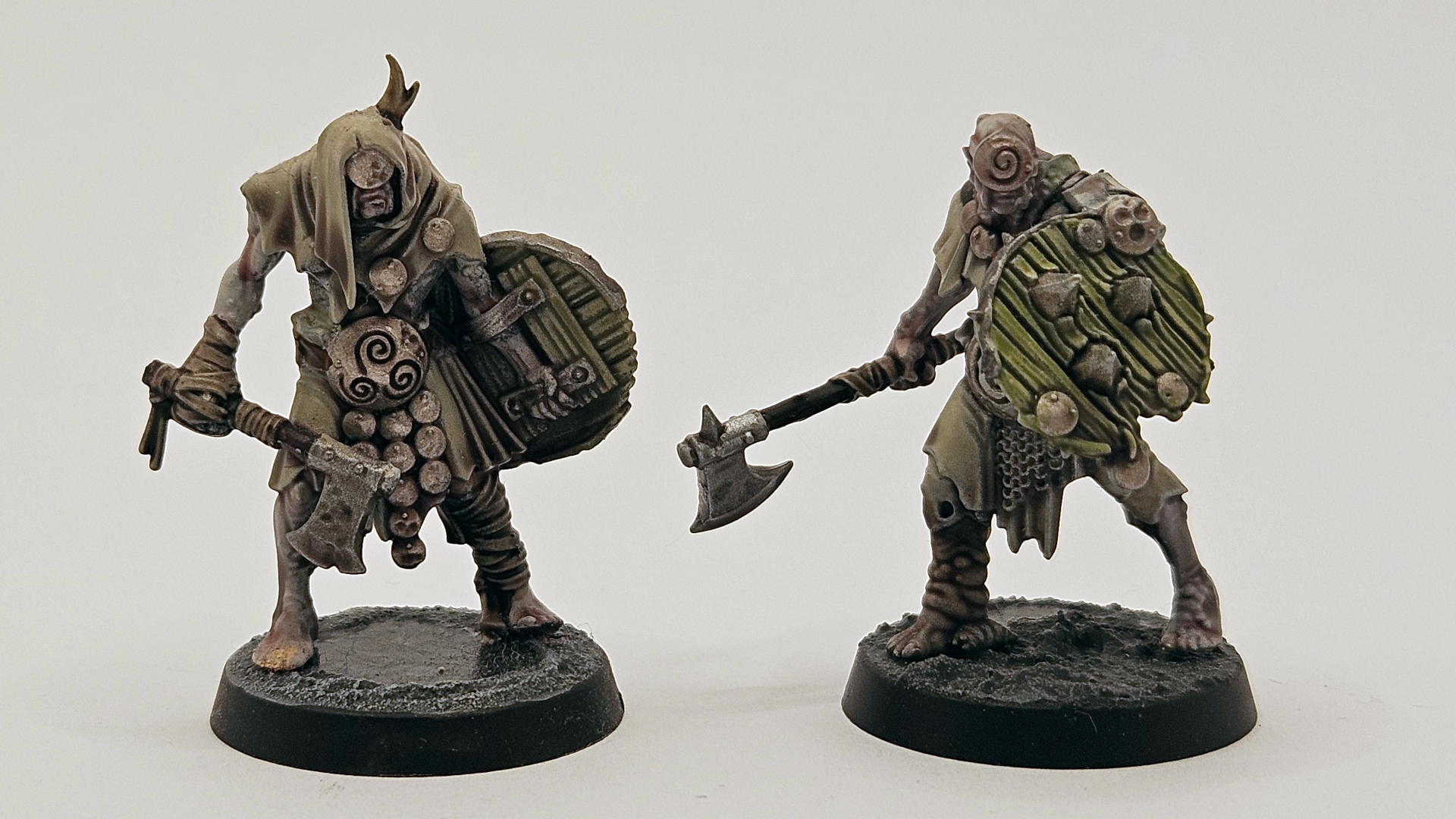 Two fully painted Pox Wretch models against a plain background