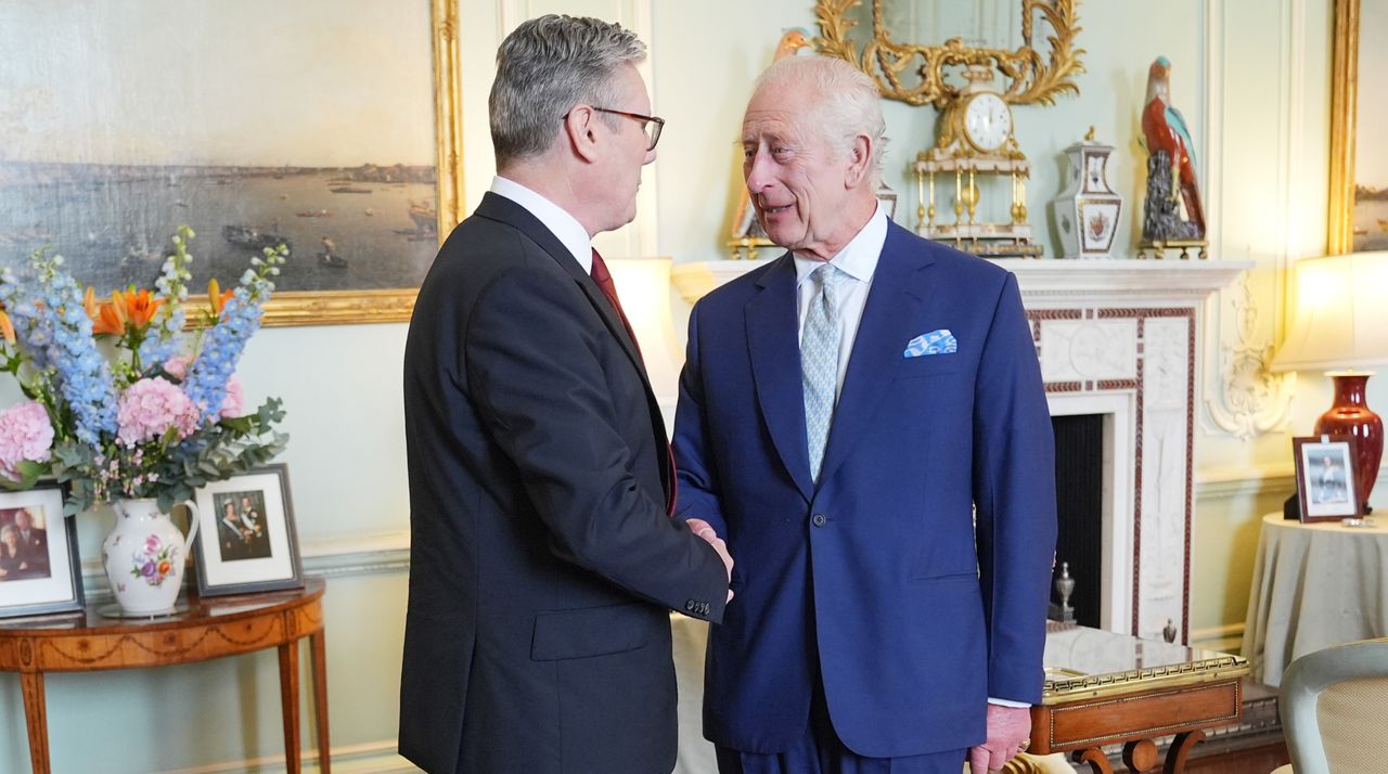 King Charles III welcomes Sir Keir Starmer during an audience at Buckingham Palace, where he invited the leader of the Labour Party to become Prime Minister and form a new government following the landslide General Election victory for the Labour Party, on July 5, 2024 in London, England. 