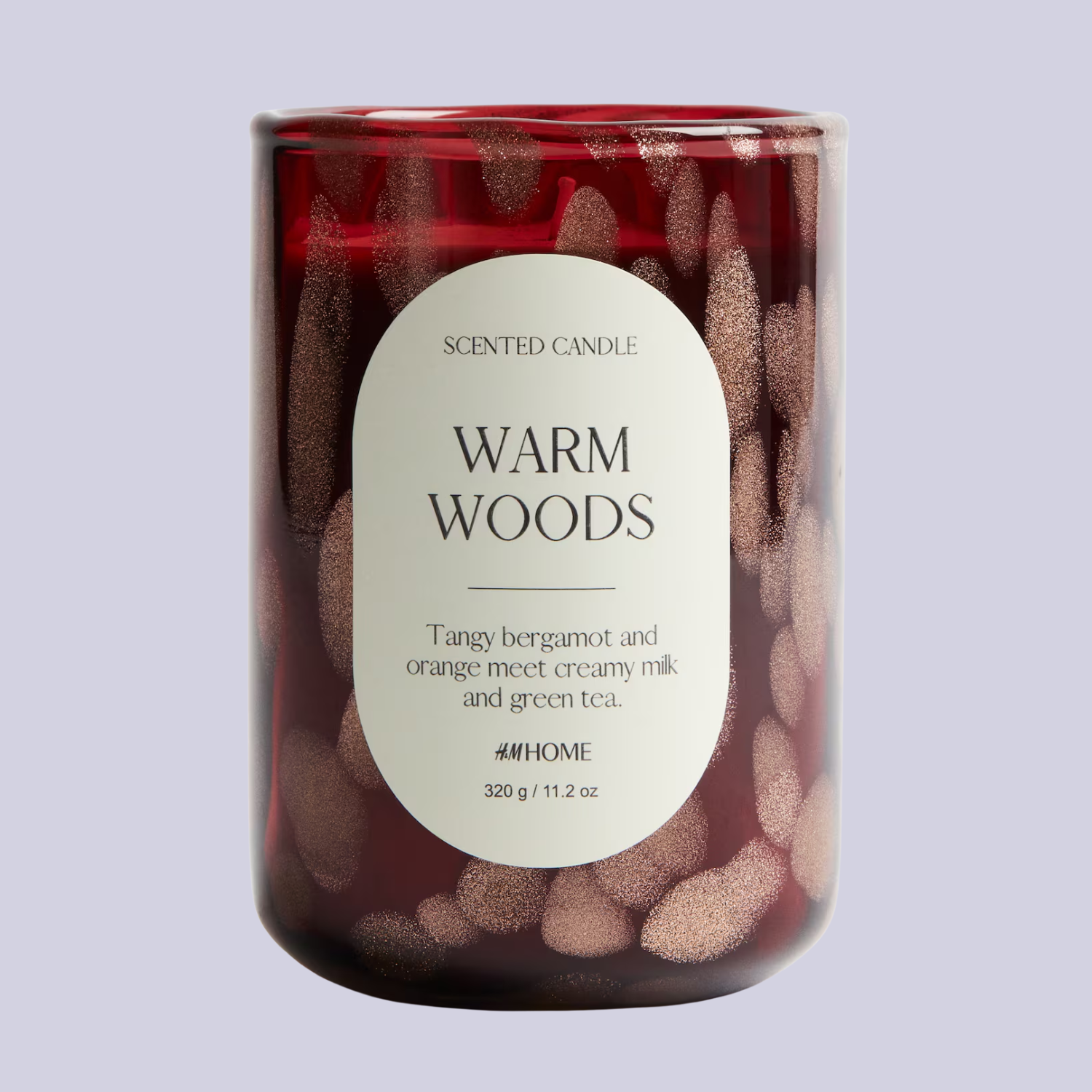 A sparkly red glass scented candle