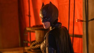 Ruby Rose as Batwoman wearing the bat suit.