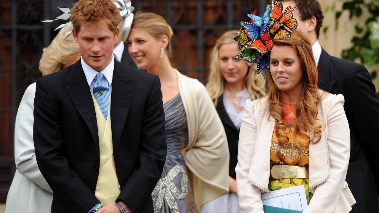 Prince Harry stands with cousin Princess Beatrice at the wedding of Peter Phillips to Autumn Kelly, at St George&#039;s Chapel in Windsor Castle on May 17, 2008 in Windsor, England.