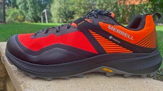 Merrell MQM 3 GTX hiking shoe on stone bench