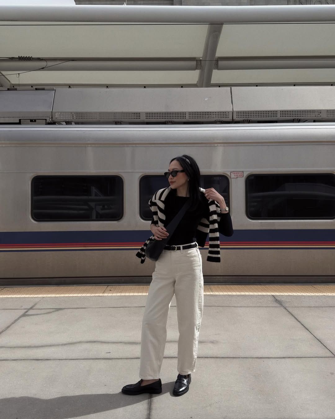 @dawn.tan wear a pair of cream jeans with a black T-shirt and a striped jumper
