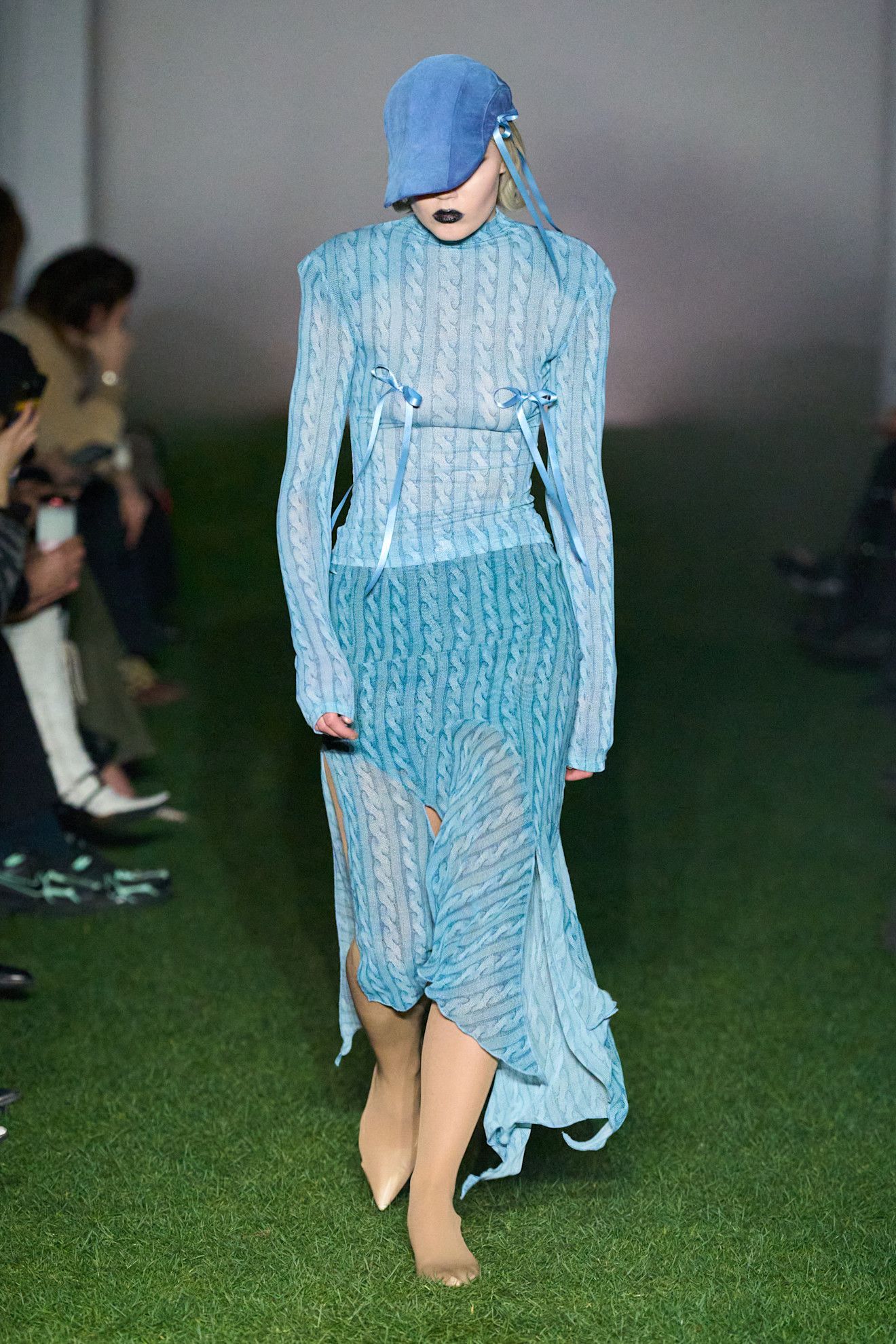 Model wears the baby blue color trend on the runway.