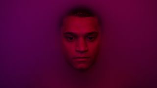 Quarterback Cameron Cade immersed in a liquid.