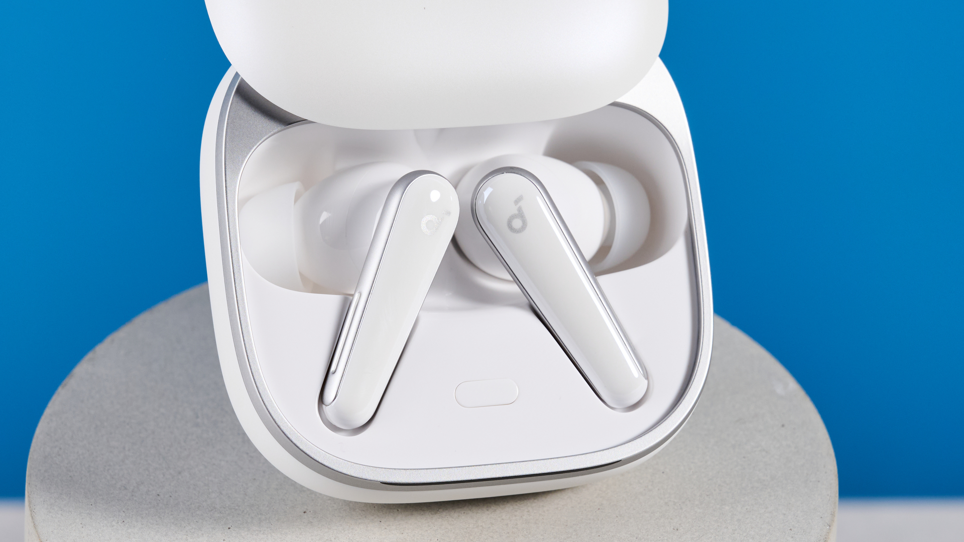 The Soundcore Liberty 5 photographed in front of a blue background.