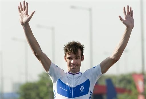 David Millar (Scotland) raises his arms in celebration after claiming the gold medal