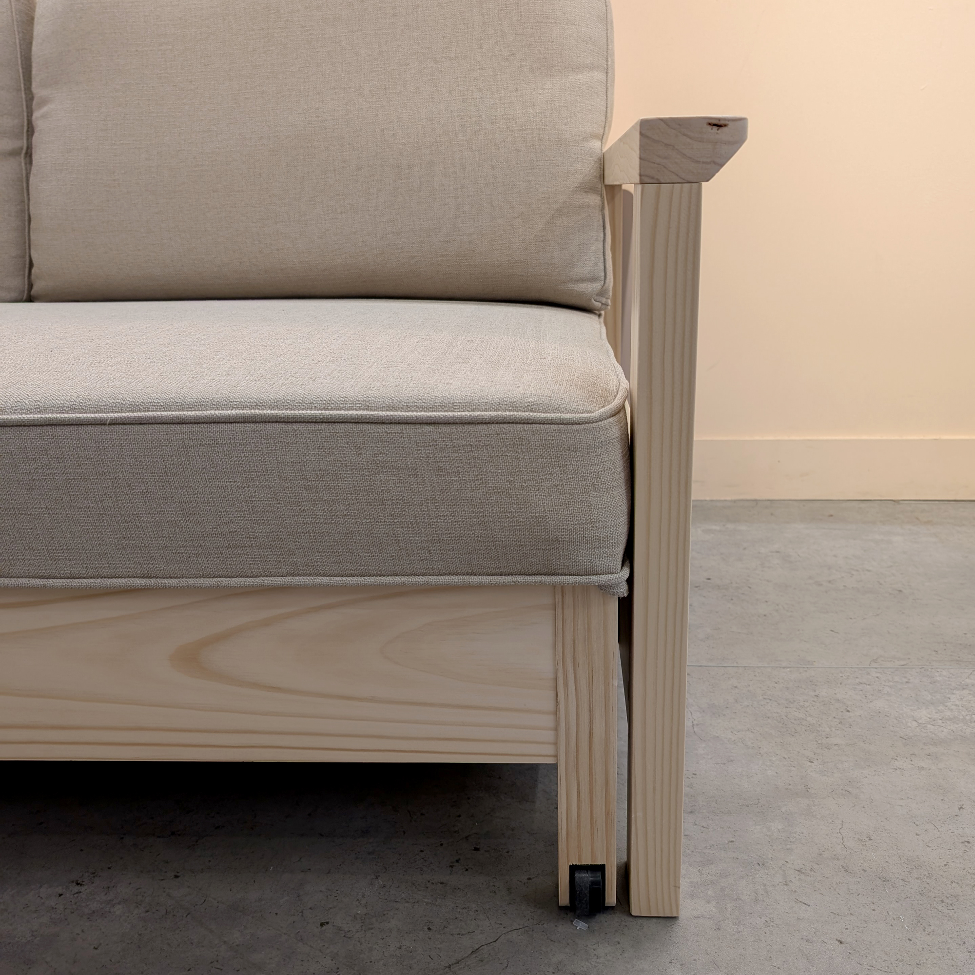 The solid pine frame of the IKEA TORNSBORG sofa bed close up