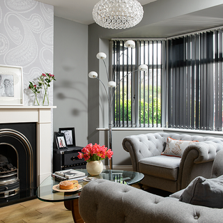 grey living room with sofa and fire place