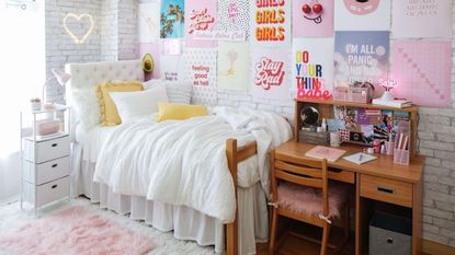 Dorm with white bed and wall art