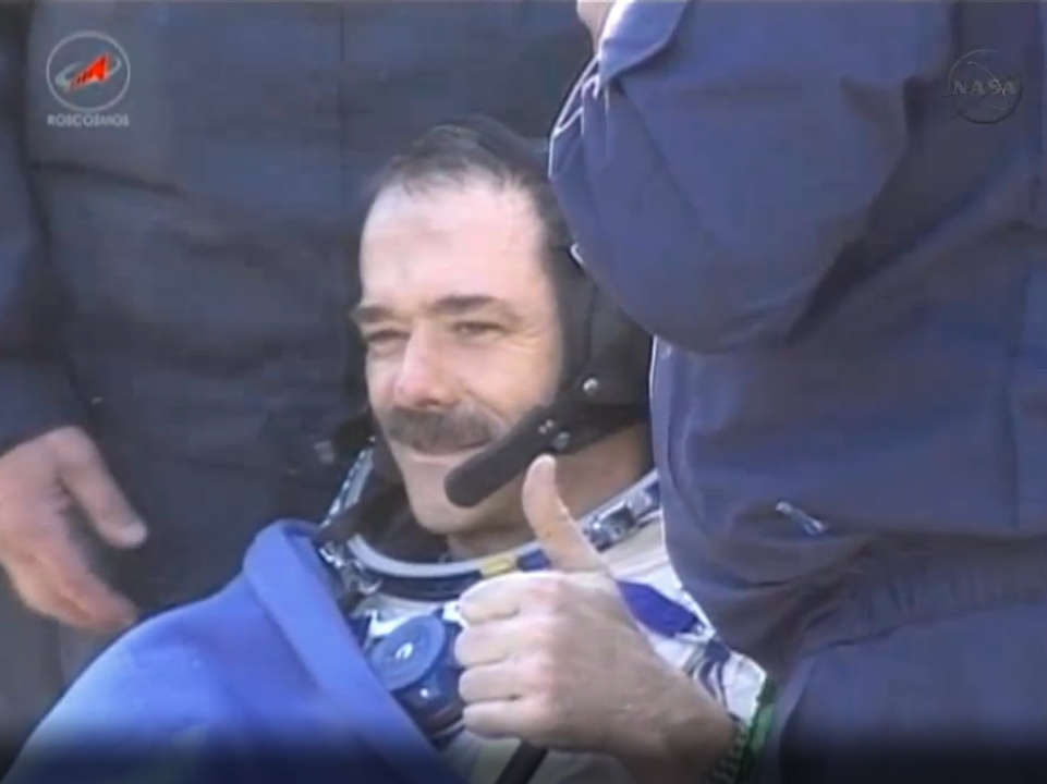 Canadian astronaut Chris Hadfield gives a thumb&#039;s up sign after successfully returning to Earth on May 14, 2013 (May 13 EDT) aboard a Soyuz space capsule following a five month mission. Hadfield commanded the Expedition 35 mission to the International Spa