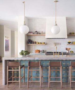 Kitchen with blue tiled island