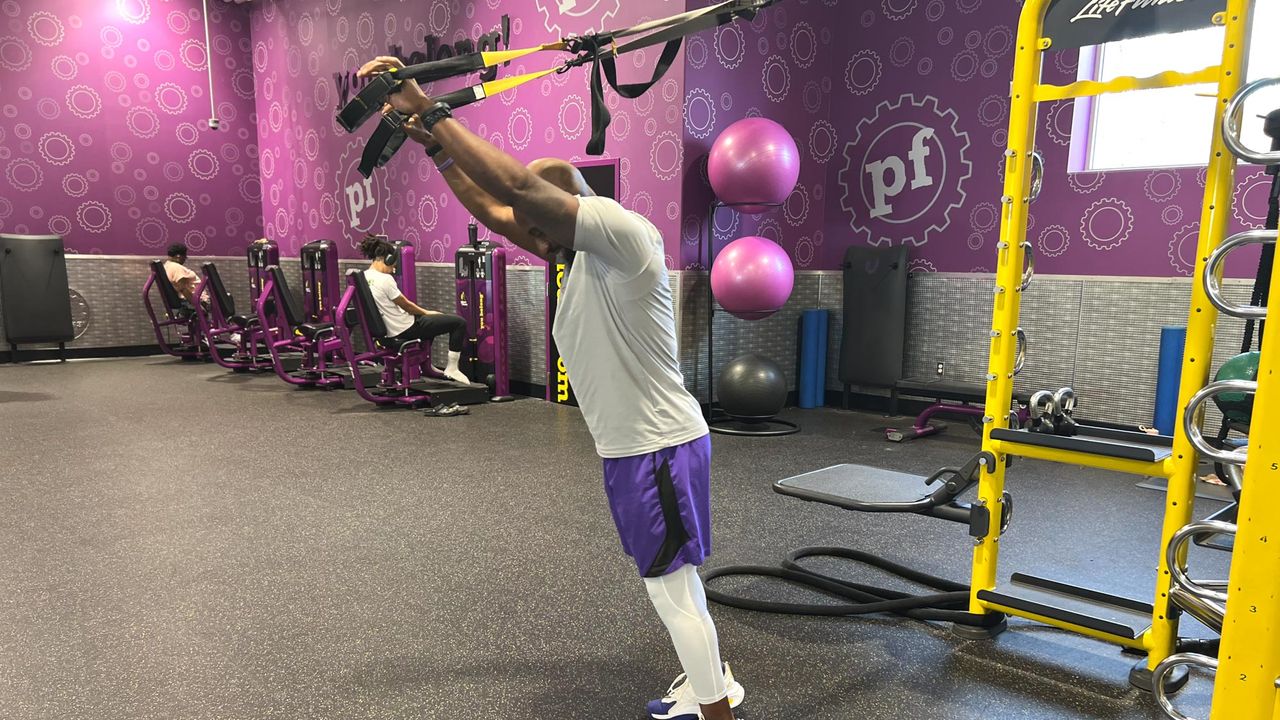 Teddy Savage performing a TRX triceps extension