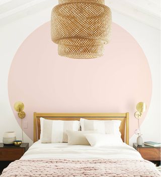 pink circle paint effect above bed