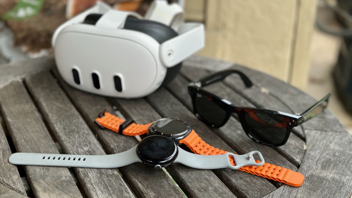 The Google Pixel Watch 3, Samsung Galaxy Watch Ultra, Ray-Ban Meta smart glasses, and Meta Quest 3 sitting on a table together.