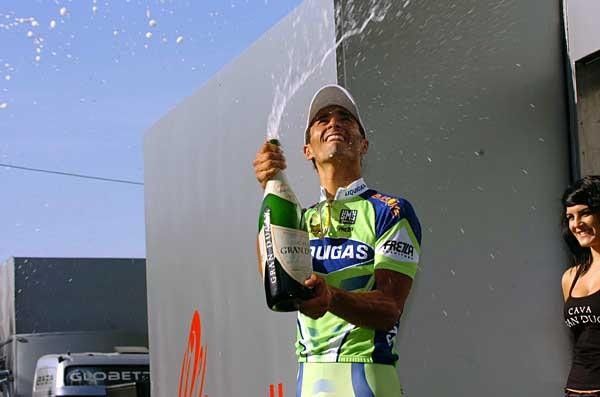Champagne shower: Daniele Bennati (Liquigas) bursts the bubbly on the podium.
