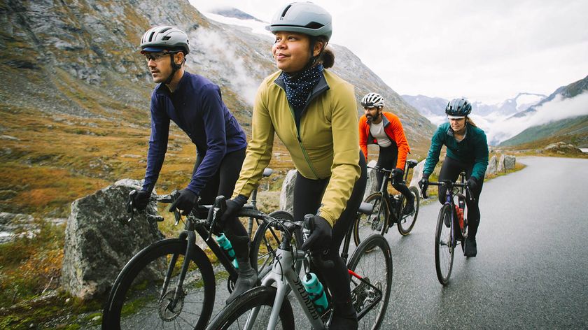 Four ridres climbing a mountain road on bikes