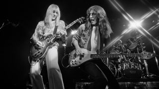 Alex Lifeson and Geddy Lee from Canadian group Rush perform live on stage in Springfield, Massachusetts 9th December 1976 during their All The World's a Stage tour.