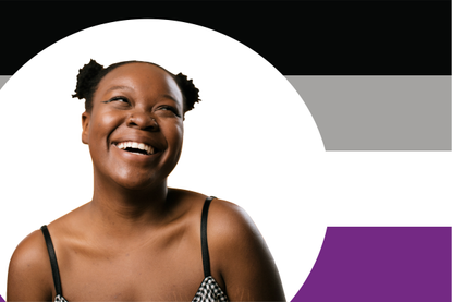 Woman smiling in front of asexual flag