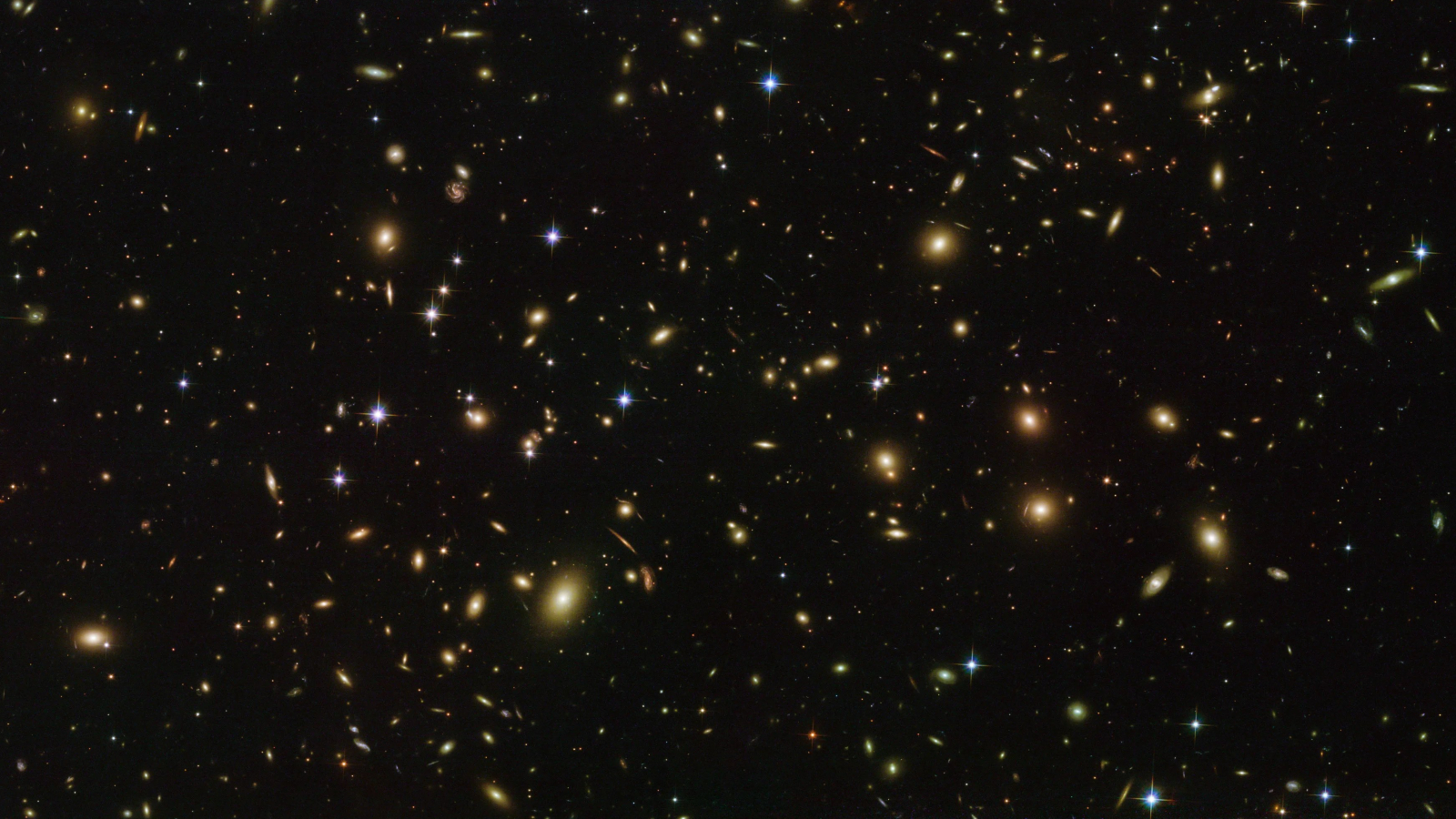 A photo of hudnreds of glowing stars in the 'cosmic firefly' galaxy