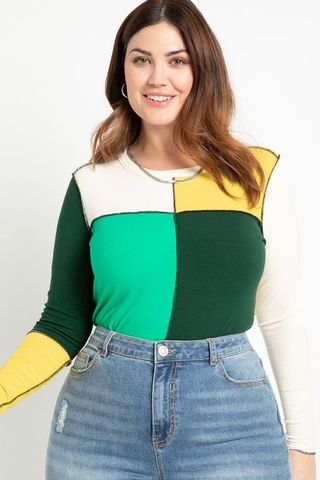 model wearing green patchwork shirt