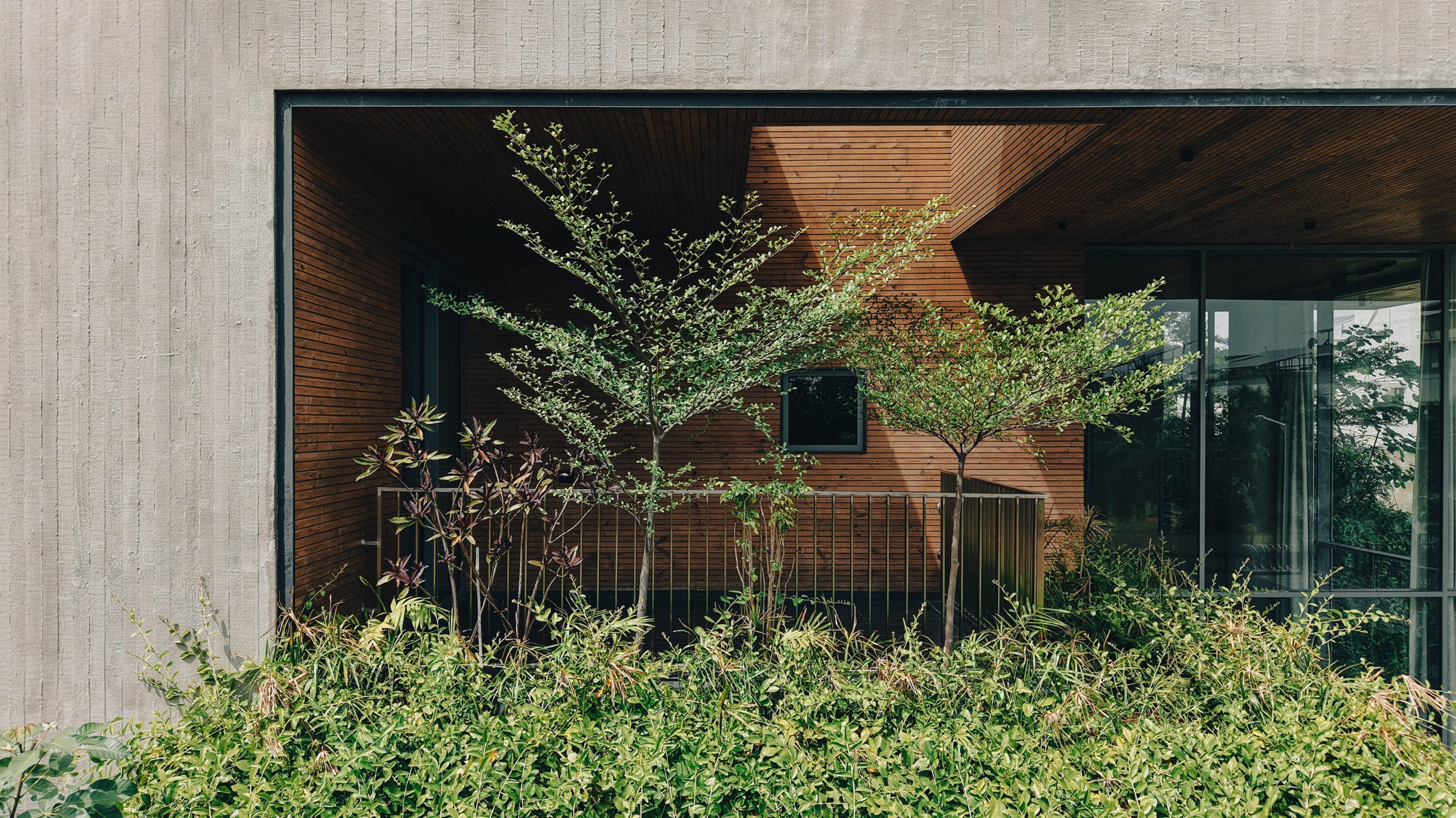 Balconies and terraces are cut into the solid form
