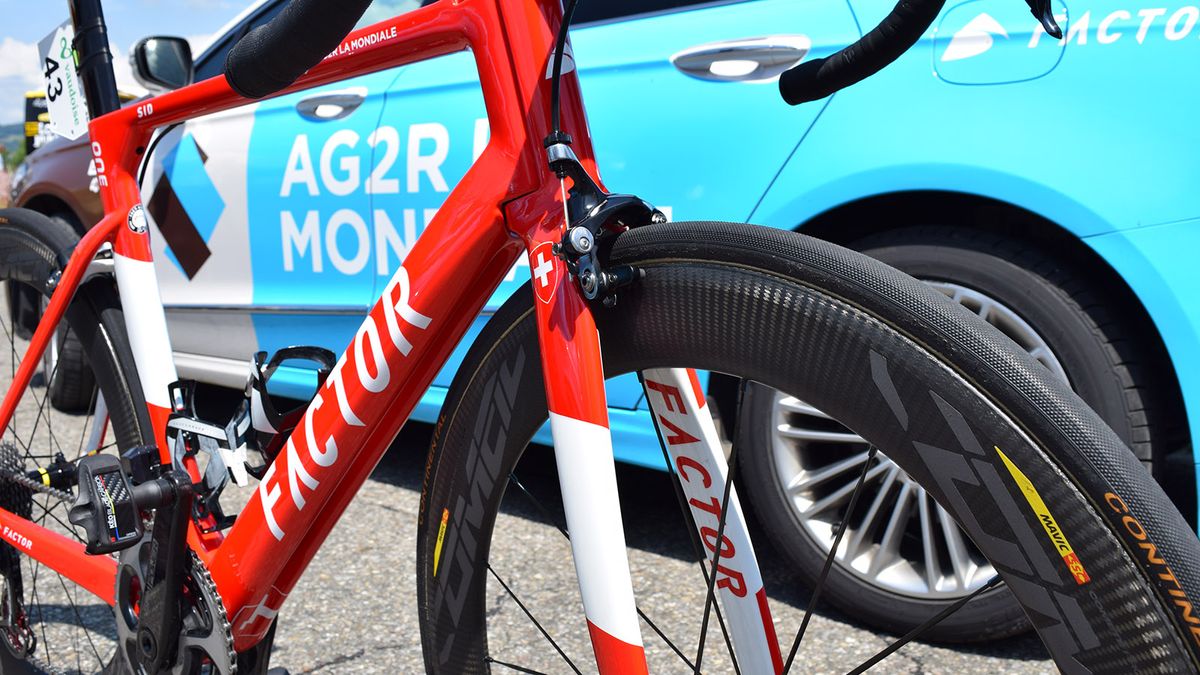 The red and white design for the Swiss champion stands out amongst the light blue bikes of Dillier's teammates
