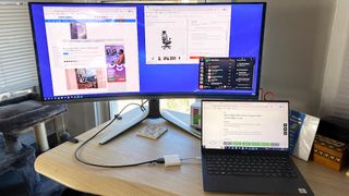 Alienware monitor with a laptop on a desk