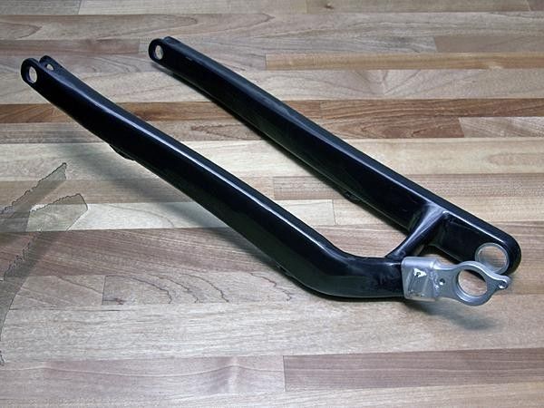Last year's asymmetrical aluminum swingarm has been replaced by a new carbon unit.