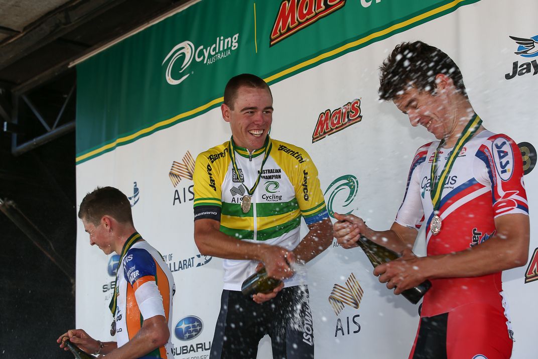 The champagne gets sprayed on the podium