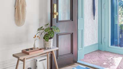 a hallway with different color painted doors